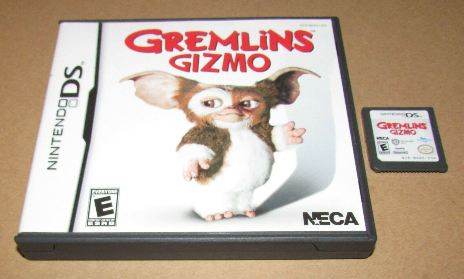 Imagen de caja y cartucho de Gremlins Gizmo de Nintendo DS lanzados en 2011